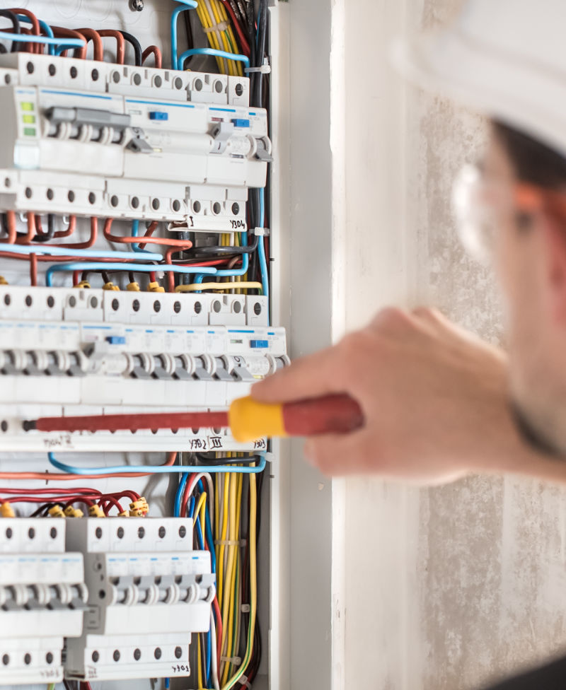 image of man installing electric fuse